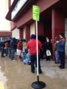 People waiting in the rain to see the movie!