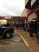 People waiting in the rain to get into the Fat Kid movie...