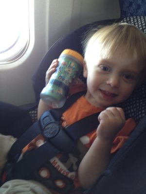 Ashton on the airplane flying to TX